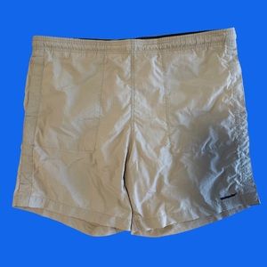 The Weekender beige swim trunks (note small holes)